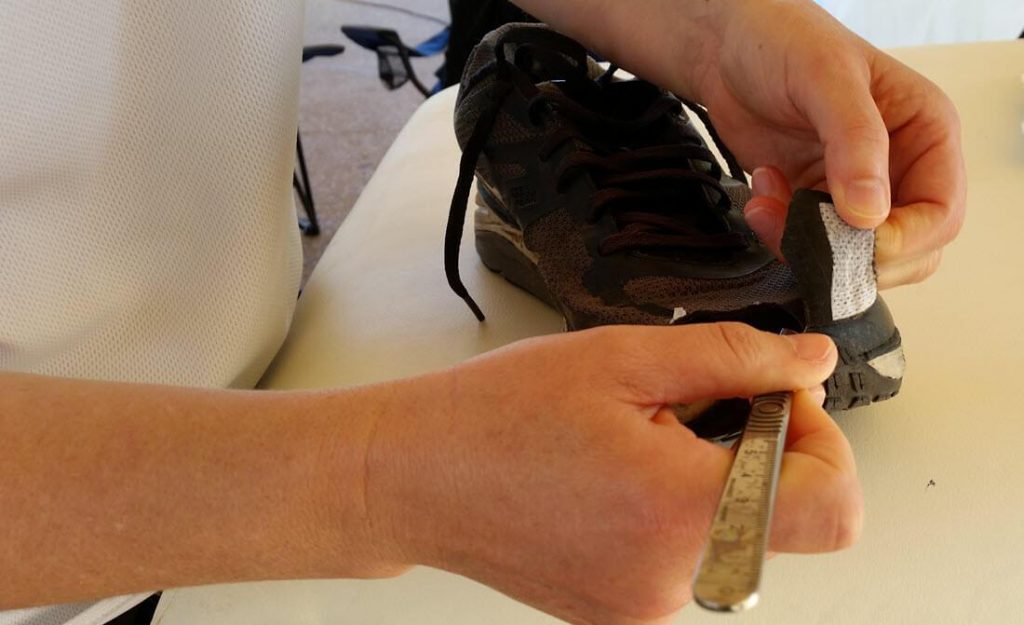 cutting the shoe to give toenail blister relief. This is what can be necessary when pre-race toenail care is neglected
