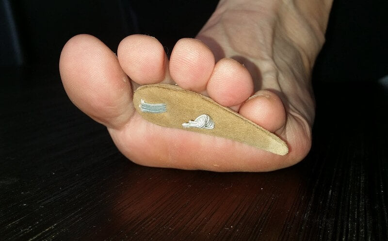 Off-the-shelf toe prop (elastic over the toe to hold it in place).