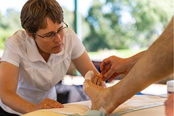 BlisterPod Rebecca Rushton tending to patient